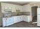 View of kitchen with white cabinets and flooring at 1440 Rhodes Rhyne Rd, Lincolnton, NC 28092