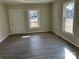 Spacious living room featuring vinyl plank flooring and large windows at 1440 Rhodes Rhyne Rd, Lincolnton, NC 28092