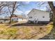 View of the house's backyard, revealing an outdoor space with a two-story home and an outbuilding at 1712 S Main St, Salisbury, NC 28144