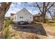 Spacious backyard with mature trees and a view of neighboring homes at 1712 S Main St, Salisbury, NC 28144