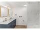 Elegant bathroom featuring double sinks, modern fixtures, marble tile, and stylish vanity at 1712 S Main St, Salisbury, NC 28144