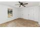 Spacious bedroom with hardwood floors, ceiling fan, and double closets at 1712 S Main St, Salisbury, NC 28144