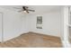 A serene bedroom features a neutral color palette, hardwood floors and a classic ceiling fan at 1712 S Main St, Salisbury, NC 28144