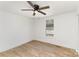 Bright bedroom features a ceiling fan and wood-look floors at 1712 S Main St, Salisbury, NC 28144