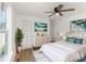 Bright bedroom featuring a ceiling fan, modern decor, fresh paint, and natural light from the large window at 1712 S Main St, Salisbury, NC 28144