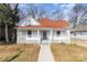 Renovated home with white exterior, red roof, and walkway at 1712 S Main St, Salisbury, NC 28144