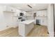 Bright kitchen featuring white cabinetry, stainless appliances, and a center island with pendant lighting at 1712 S Main St, Salisbury, NC 28144