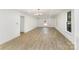 Bright and airy living room featuring hardwood floors and a modern chandelier at 1712 S Main St, Salisbury, NC 28144