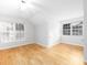Bright bedroom features hardwood floors and natural light from multiple windows at 172 Foxtail Dr, Mooresville, NC 28117