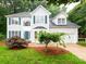 Traditional two-story home featuring a well-maintained lawn and an attached two-car garage at 172 Foxtail Dr, Mooresville, NC 28117