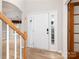 Inviting foyer featuring wood-look floors, white trim, and natural light at 172 Foxtail Dr, Mooresville, NC 28117