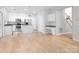 Open-concept kitchen with stainless steel appliances, island, and adjacent breakfast nook at 172 Foxtail Dr, Mooresville, NC 28117