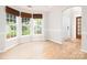 Bright living room featuring wood-look floors, large windows, and neutral paint at 172 Foxtail Dr, Mooresville, NC 28117