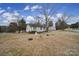 House with a yard, and mature trees in the background at 1955 Gilmore Rd, Rock Hill, SC 29730