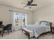 Comfortable bedroom with a ceiling fan, lots of natural light and a writing desk at 200 Staffordshire Dr, Statesville, NC 28625