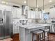 Well-lit kitchen featuring a central island with seating, stainless steel appliances, and ample cabinet space at 200 Staffordshire Dr, Statesville, NC 28625