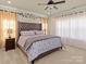 Serene main bedroom featuring neutral tones, carpet floors, a ceiling fan and soft natural light at 200 Staffordshire Dr, Statesville, NC 28625