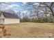 Large backyard with detached garage and trees at 202 W Main St, Cherryville, NC 28021