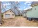 Home's backyard with detached garage and AC unit at 202 W Main St, Cherryville, NC 28021