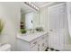 Clean bathroom with double vanity, large mirror and checkerboard floor at 202 W Main St, Cherryville, NC 28021