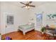 Charming bedroom with hardwood floors, window seat and built-in desk at 202 W Main St, Cherryville, NC 28021