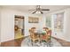 Dining room with hardwood floors, glass table and four chairs at 202 W Main St, Cherryville, NC 28021