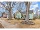 Charming light green house with mature trees and manicured lawn at 202 W Main St, Cherryville, NC 28021