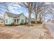 Light green house on tree lined street with a spacious yard at 202 W Main St, Cherryville, NC 28021