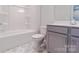 Bathroom view featuring new vanity, toilet, and tub with white finishes at 216 Gilead Rd, Huntersville, NC 28078