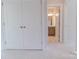 Bathroom view highlighting double doors, new vanity, and patterned floor tiles at 216 Gilead Rd, Huntersville, NC 28078