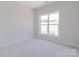 Neutral bedroom featuring a large window allowing for natural light at 216 Gilead Rd, Huntersville, NC 28078