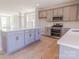 Spacious kitchen with a large island, modern stainless steel appliances, and shaker-style gray cabinets at 216 Gilead Rd, Huntersville, NC 28078