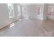 Bright living room featuring lots of natural light, wood-look floors, and modern, neutral paint at 216 Gilead Rd, Huntersville, NC 28078