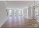 Spacious living room with ample natural light from many windows and views of the trees outside at 216 Gilead Rd, Huntersville, NC 28078