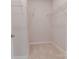 Neutral walk-in closet with carpet and metal shelves ready for organizing at 216 Gilead Rd, Huntersville, NC 28078