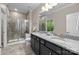 Bathroom with double vanity, granite countertop, decorative plant, and a large glass shower at 250 Cherry Tree Dr, Fort Mill, SC 29715