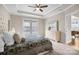 This bedroom features a ceiling fan, a large window, a dresser, and a doorway into the next room at 250 Cherry Tree Dr, Fort Mill, SC 29715