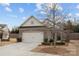 Charming home featuring a two-car garage, stone accents, and a well-maintained lawn at 250 Cherry Tree Dr, Fort Mill, SC 29715