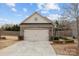 Charming home featuring a two-car garage, stone accents, and a well-maintained lawn at 250 Cherry Tree Dr, Fort Mill, SC 29715