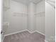 A large walk-in closet with wire shelving and neutral carpet at 250 Cherry Tree Dr, Fort Mill, SC 29715