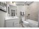 Bathroom featuring a tub-shower combo, white vanity, neutral tile, and modern fixtures at 2533 Ellen Ave # 1016B, Charlotte, NC 28208