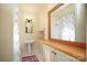 Bathroom with pedestal sink, shower, and built-in vanity at 258 Fenton Pl, Charlotte, NC 28207