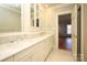 Bathroom with double vanity, updated tilework, and built-in storage at 258 Fenton Pl, Charlotte, NC 28207