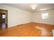 Spacious bedroom with hardwood floors and access to another room at 258 Fenton Pl, Charlotte, NC 28207