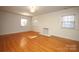 Bright bedroom with hardwood floors, fireplace, and multiple windows at 258 Fenton Pl, Charlotte, NC 28207