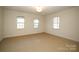 Well-lit bedroom with carpet flooring and neutral walls at 258 Fenton Pl, Charlotte, NC 28207