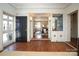 Elegant entryway with dark hardwood floors and view to living room at 258 Fenton Pl, Charlotte, NC 28207