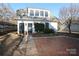 Home exterior showcasing a charming studio and brick pathway at 258 Fenton Pl, Charlotte, NC 28207