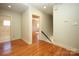 Upstairs hallway with hardwood floors and access to bedrooms at 258 Fenton Pl, Charlotte, NC 28207