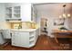 Eat-in kitchen with built-in workspace and views into dining area at 258 Fenton Pl, Charlotte, NC 28207